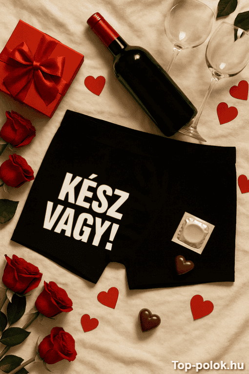 Vörösbor, ajándék doboz és szív alakú csokoládék romantikus hangulatban.