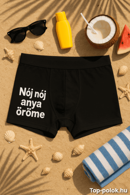 Férfi boxer rövidnadrág napozóágyon, nyári strandkiegészítők között.